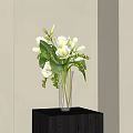 White Calla Lily Flowers In Transparent Glass Vase On Corner Table With Green Leaves