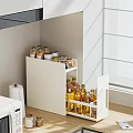 Modern White Kitchen Storage Cabinet With Bottles And Paper Towels Near Window
