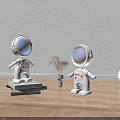 White Spherical Table Lamp With Astronaut Figurines Orange Circular Background And Small Potted Plant