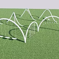 White Arched Playground Equipment with Swings and Climbing Frames on Green Grass