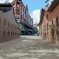 Commercial Street Featuring Traditional And Modern Buildings Stone Pavement Arch Windows And Blue Sky