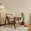 Accent Lounge Chair On Woven Rug With Floor Lamp Cactus Framed Art And Magazine Basket