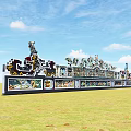 Ancient Architecture Featuring Intricate Dragon Sculptures Along Traditional Corridor Under Blue Sky