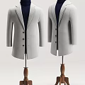Two Stylish Grey Coats Displayed On Hangers With Wooden Bases