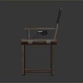 Vintage Wooden Director's Chair With Classic Typewriter Resting On Seat Surface