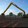 Yellow Excavator Loading Truck At Construction Site With Trees And Blue Sky