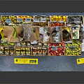 Multi Tiered Fruit Display Shelf Organized With Various Fresh Fruits Wooden Crates And Yellow Labels