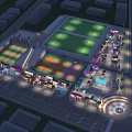 Vibrant Commercial Street At Night With Shops Food Trucks Outdoor Seating And Green Lawn Areas