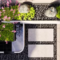 Courtyard Garden Design With Pink Blossoms Stones Green Plants And Stone Pathway