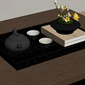 Traditional Tea Set on Black Tray with Book and Yellow Flower Vase