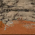 Natural Weathered Rocky Terrain With Red Sandy Ground And Scattered Small Stones