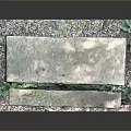 Outdoor Stone Bench And Seat Design With Moss Covered Surface And Concrete Base