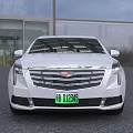 White Cadillac Luxury Limousine Featuring Extended Body And Modern Front Grille Design