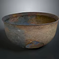 Ancient Sculpted Bowl Featuring Intricate Decorative Patterns And Bronze Patina