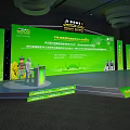 Large Conference Venue With Green Stage Speaker Red White Chairs And Big Screen