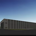Modern Industrial Factory Building With Large Windows Surrounding Greenery And Parking Area