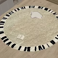 Round Carpet with Beige Center Black Stripes White Cushion Open Book on Wooden Floor