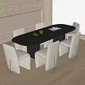 Modern Black Oval Table With White Upholstered Chairs Fruit Bowl and Book In Bright Room