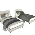 Single Bed with Light Gray Striped Upholstered Headboard Multiple Pillows and Gray Blanket Gold Legs