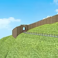 Great Wall Entrance Gate on Green Hillside With Pathway and Blue Sky