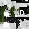 Wedding Banquet Hall With Greenery Ceiling Round Pendant Lights White Chairs And Stage