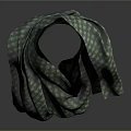Stylish Green And Gray Checkered Scarf Draped Over Mannequin Shoulder On Dark Background
