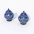 Pair of Blue and White Ceramic Jars with Intricate Floral Patterns and Lids