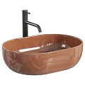 White Oval Vessel Sink with Black Faucet and Metallic Decorative Balls