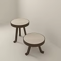 Two Different Size Wooden Stools With Round Light Seats And Dark Legs For Indoor Use