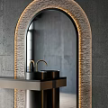 Modern Bathroom Washbasin with Arched LED Lit Mirror Black Countertop and Concrete Wall