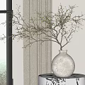 White Textured Ceramic Vase Holding Green Bud Twigs On Marble Table Near Window Curtain