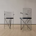 Modern Dining Chairs With Spiral Metal Frame And Black Seats On Wooden Floor