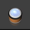 Round Metallic Object With Blue Glowing Center And Orange Black Outer Ring Shiny Surface 3d model