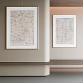 Textured Decorative Paintings Hanging On Light Colored Wall With Wooden Countertop