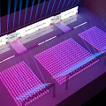 Modern Event Venue Setup With Purple Seats Stage Screens And Blue Lighting