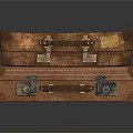 Vintage Leather Suitcases Stacked with Metal Locks and Name Tags