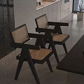 Modern Single Chair With Woven Backrest Black Frame And Green Upholstered Seat In Open Kitchen