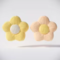 Two Plush Flower Shaped Yellow And Pink Decorative Pillows With Contrasting Centers