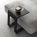 Modern Black Side Table With Glass Bowl Next To Gray Sofa