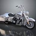 Shiny Silver Cruiser Motorcycle With Chrome Accents Black Seat Spoked Wheels And Floor Reflection