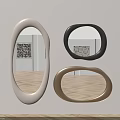 Oval Mirrors in Beige Black Brown Hanging on White Wall With Wooden Floor Reflecting Artwork