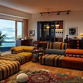 Cozy Living And Dining Room Interior With Colorful Striped Sofas Large Windows And Sea View
