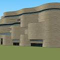 Modern Museum Building With Stone Exterior Curved Roof Large Glass Windows And Geometric Design