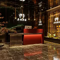 Elegant Hotel Lobby with Red Reception Desk Marble Floor Decorative Trees and Lighting