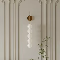 Modern Wall Lamp With Golden Base And White Spherical Glass Globes For Interior Decor
