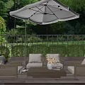 Outdoor Wicker Sofa Set with Umbrella on Patio with Greenery and Railing