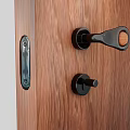 Black Metal Door Handle With Wooden Accent On Brown Wooden Door Interior