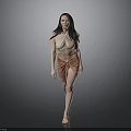 Stylish Woman in Beige Top and Orange Wrap Skirt Walking Against Gray Background