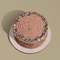 Delicious Chocolate Cake With Ruffled Frosting Topped With Chocolate Sprinkles On Round Plate