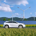 Modern Electric Car Parked By Solar Panels With Wind Turbines In Green Field Blue Sky
